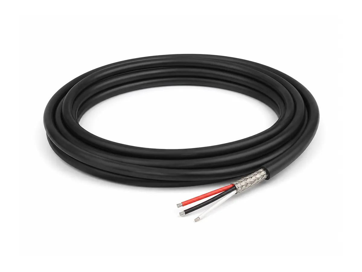 Coiled DeviceNet bus cable on white background